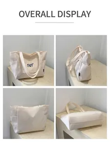 Détails des vues avant, latérale et inférieure du sac cabas blanc cassé avec broderie TGT