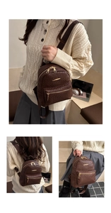 Detailed macro view of dark brown woven texture PU leather and gold zipper on a mini backpack