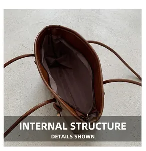Internal structure of large brown leather tote bag with zip closure and spacious interior