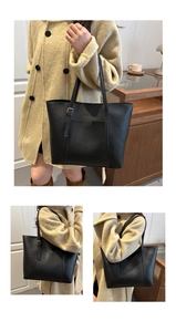 Close-up of black PU leather tote bag with lychee texture and adjustable shoulder strap