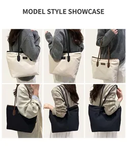 Detail showing high-capacity tote bags in cream and black with stylish leather straps
