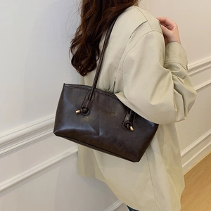 Retro coffee brown leather tote bag with knotted shoulder straps and fashion logo