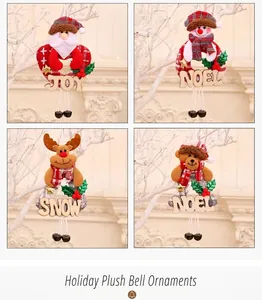 Detail view of festive fabric ornaments with wooden letter tags and metal bells