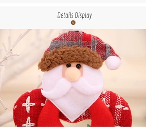 Close-up of Santa plush hanging ornament with soft fabric textures and hand-stitched details