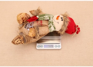 Detail of snowman Christmas gift bag weighing 52.6g with clear window and burlap fabric