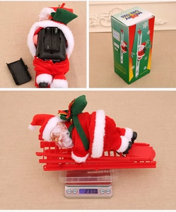 Detail view of electric Santa climbing ladder toy showing battery compartment and weight