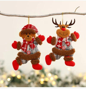 Detail view of plush Teddy bear and reindeer Christmas ornaments with festive plaid scarves