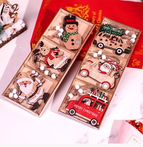 Detailed view of colorful wooden Christmas ornaments with festive car and Santa motifs