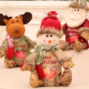 Christmas plush apple gift bags featuring Santa, snowman, and reindeer with heart window