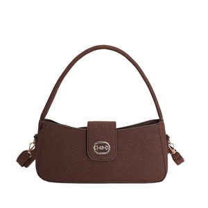 Deep brown baguette bag with textured grain surface and gold oval buckle on white background