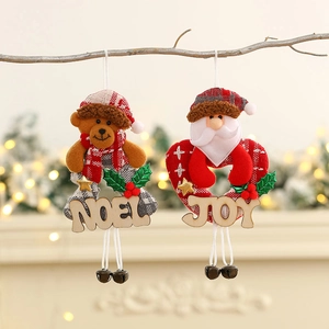 Christmas tree hanging ornaments with teddy bear, Santa, wooden letters and metal bells