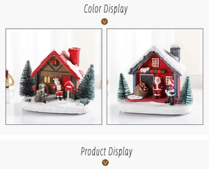 Detail view of miniature resin Christmas houses with Santa Claus and festive scene elements