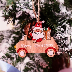 Wooden Santa in car hanging ornament with Merry Christmas text on a snowy Christmas tree