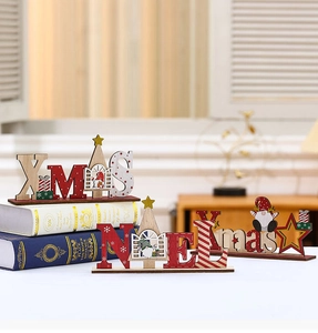 Detail of DIY Christmas wooden XMAS and NOEL table signs with Santa and snowflake motifs