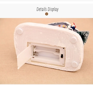 Detail view of the battery compartment and power structure of the Christmas resin house