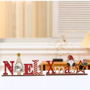Detail of wooden Noel and Xmas table signs with cute gnomes and snowflake patterns