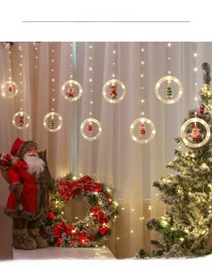 Detail of warm white LED Christmas ring curtain lights with Santa and reindeer figurines