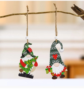 Detail of wooden gnome ornaments with hanging ropes and beads for Christmas tree decoration
