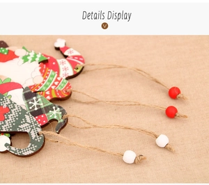 Close-up of wooden Christmas gnome pendant with rustic twine rope and decorative beads