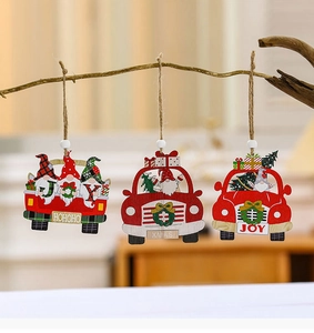 Detail view of 3-piece wooden Christmas gnome car ornaments hanging on a rustic branch