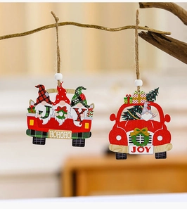Detail of wooden gnome car ornaments hanging on a branch with warm holiday vibes
