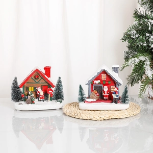 Luminous Christmas resin miniature houses with snow details and Santa figurines on a white base