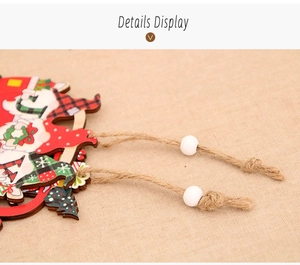 Detail of wooden Christmas gnome ornament with red plaid pattern and rustic twine string