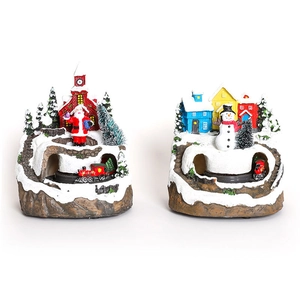 Musical rotating Christmas resin miniatures with Santa, snowman and train on white background
