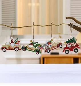 Macro view of four wooden Christmas car ornaments with gnomes and trees on branches