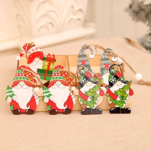 Set of 12 festive wooden gnome ornaments in a display box for Christmas tree decoration