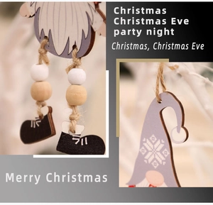 Detail of wooden Christmas gnome ornament with beaded legs and jute hanging rope