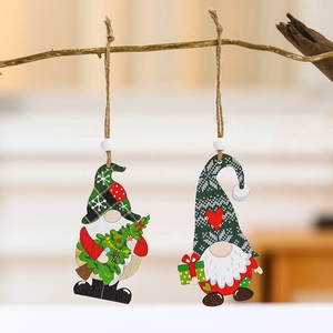 Set of 2 Christmas wooden gnome ornaments with plaid hats hanging on a tree branch