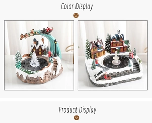 Close-up of a Christmas resin fountain with Santa sleigh and glowing trees