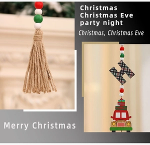 Close-up of wooden Christmas gnome pendant with beads, plaid letter H and red truck detail