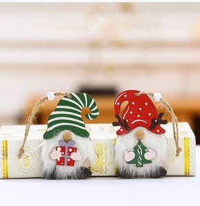 Detailed view of two wooden gnome ornaments with plush beards and festive XMAS decorations