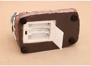 Detail of resin ornament base with battery compartment speaker and non-slip pads