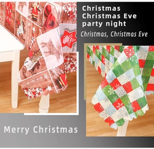 Detailed view of Christmas tablecloth with reindeer pattern and laser-cut wavy edges