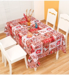 Close-up of Christmas tablecloth featuring vintage wood texture and festive reindeer patterns