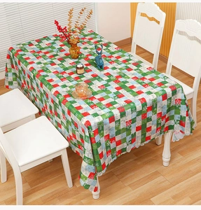 Close-up of Christmas plaid tablecloth with snowflake patterns and wavy scalloped edges