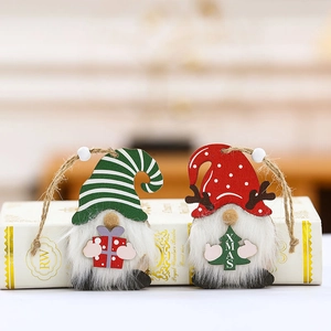 Wooden Christmas gnome ornaments with white beards and festive gift patterns