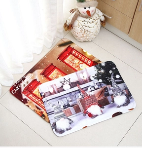 Detailed view of plush Christmas floor mats featuring red festive designs and gnomes