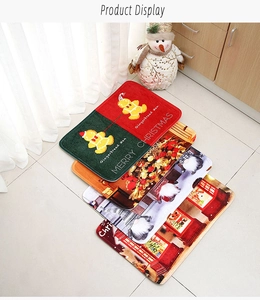 Close-up of crystal velvet Christmas door mats featuring gingerbread man and festive prints