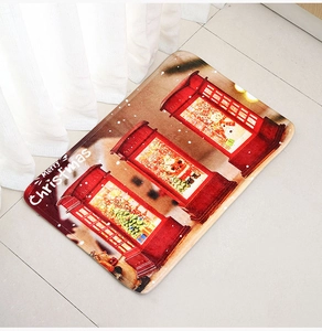 Close-up of a Christmas doormat with red phone booths, Santa Claus, and snowmen