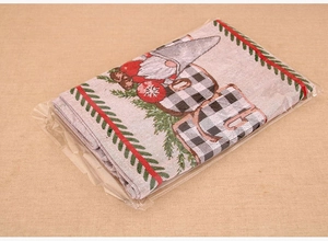 Detail of knitted Christmas gnome table runner with red and black plaid pattern