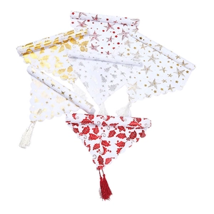 Christmas table runner set with gold foil patterns and festive tassels for home decor