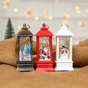 Set of three LED Christmas lanterns with Santa, Snowman and Reindeer patterns