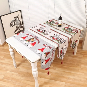 Christmas knitted table runners with Santa gnome patterns and festive red tassels