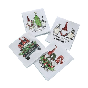 Set of four white Christmas gnomes hand towels with festive truck and tree prints