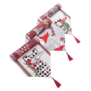 Three Christmas knitted table runners with gnomes and fringe on a white background