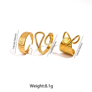 Detailed view of three-piece gold geometric stainless steel rings with hammer texture